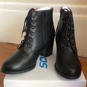 Black heeled combat booties